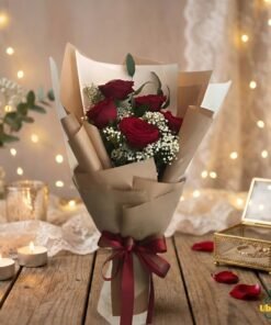 Classic romance red rose bouquet wrapped in elegant brown paper with soft candlelight background