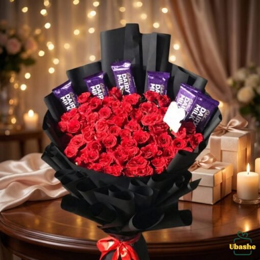 Romantic bouquet of red roses and chocolates wrapped in elegant black paper